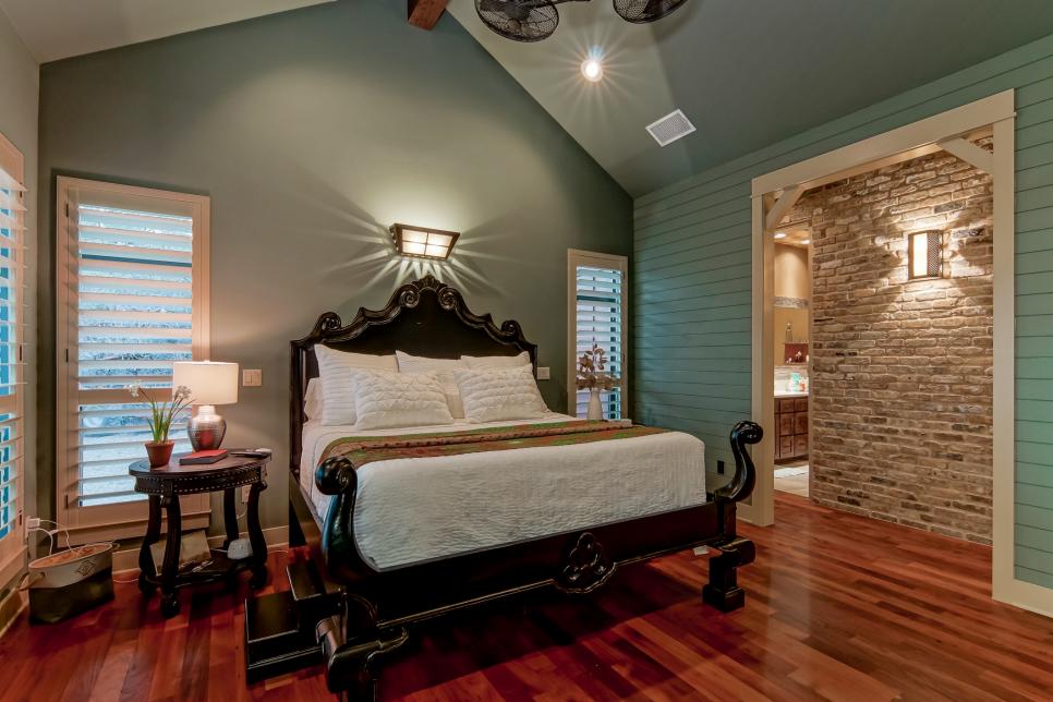 blue bedroom with elegant dark wood bed