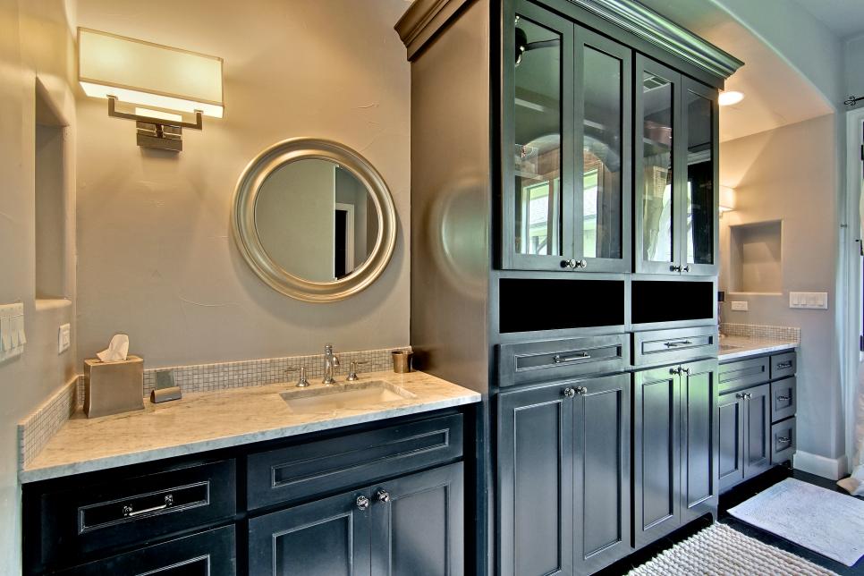 elegant master bathroom boasts plenty of storage