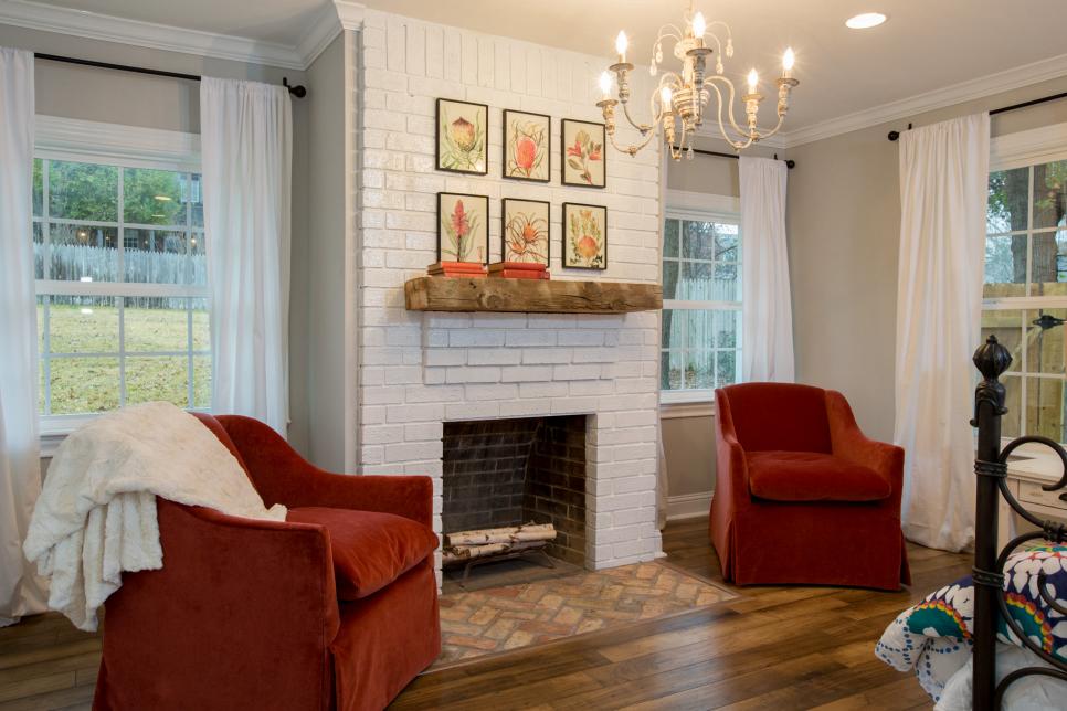 white paint on the brick fireplace in bedroom