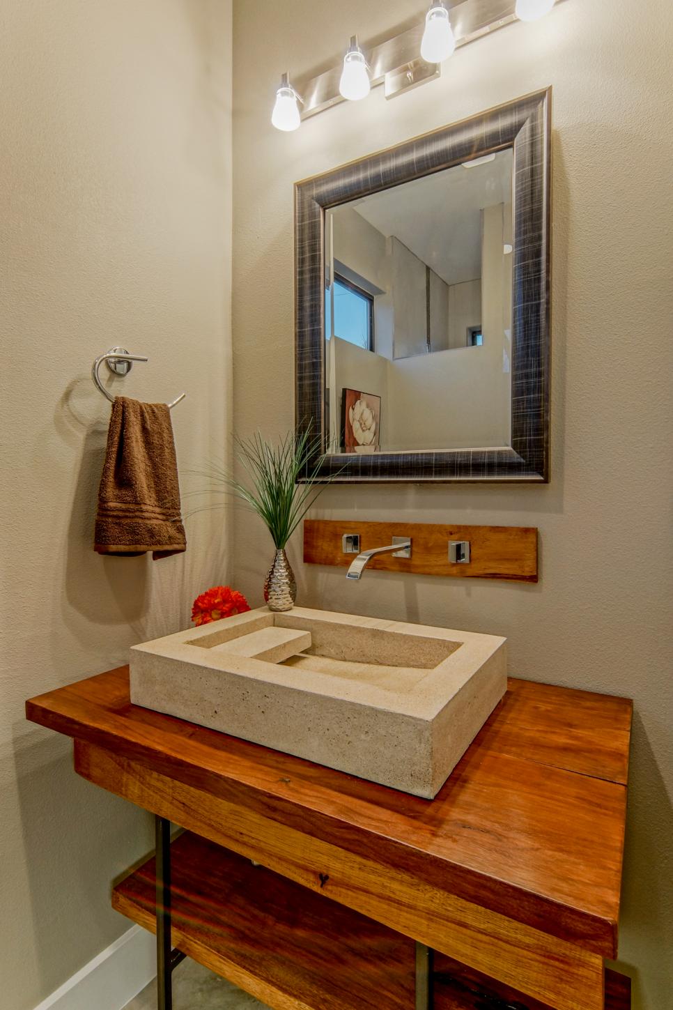 bathroom with custom vanity with charcoal mirror
