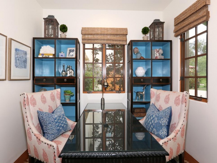 multicolored eclectic home office with blue cabinet