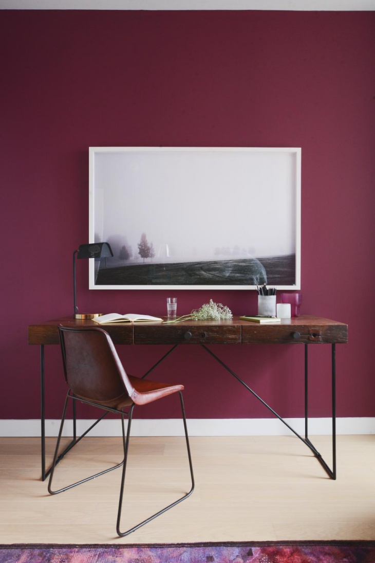purple home office with clean lined furniture