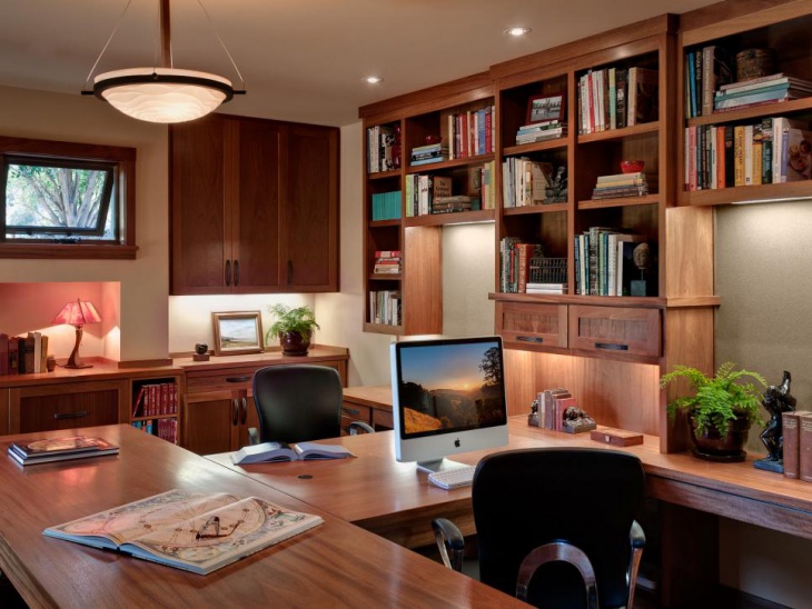 transitional home office with library table and custom desk