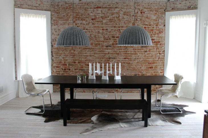 neutral contemporary dining room with gray pendants