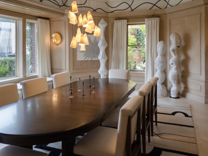dining room with fancy pendant lights