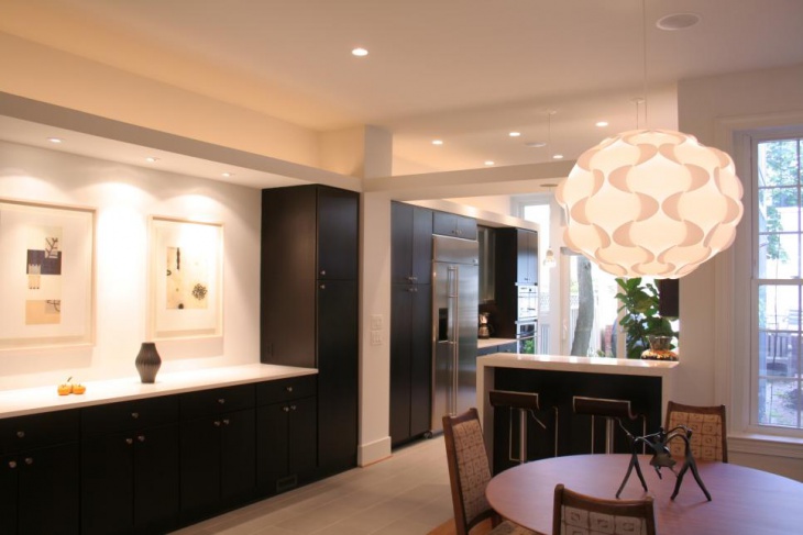 contemporary neutral dining room with funky pendant