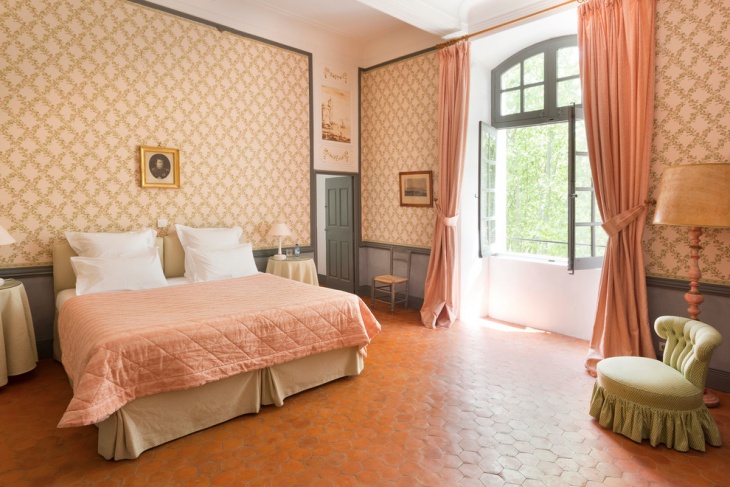 peach color chateau bedroom with designed wall