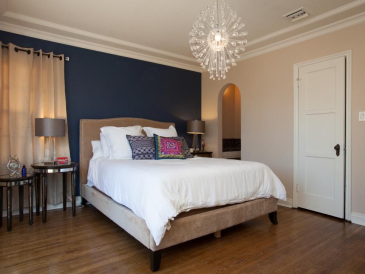 nice bedroom with contemporary light fixture