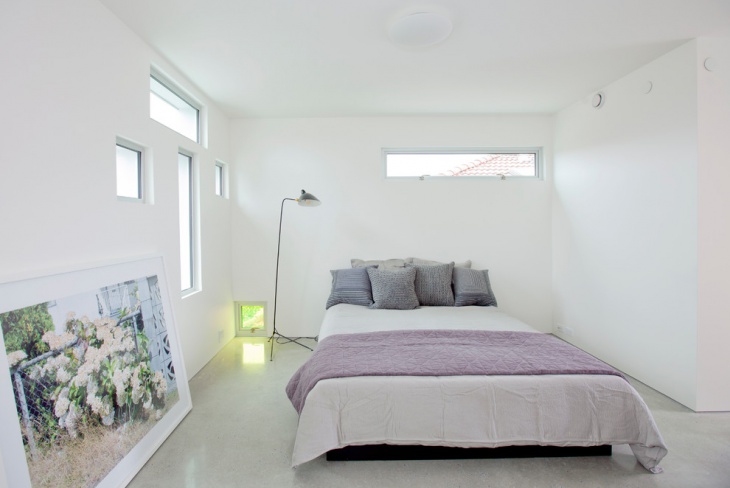dreamy white bedroom with floor lamp lighting