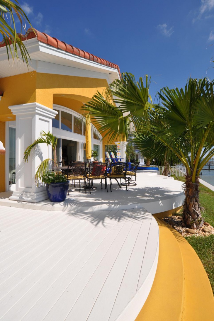 mediterranean home boasts large white deck