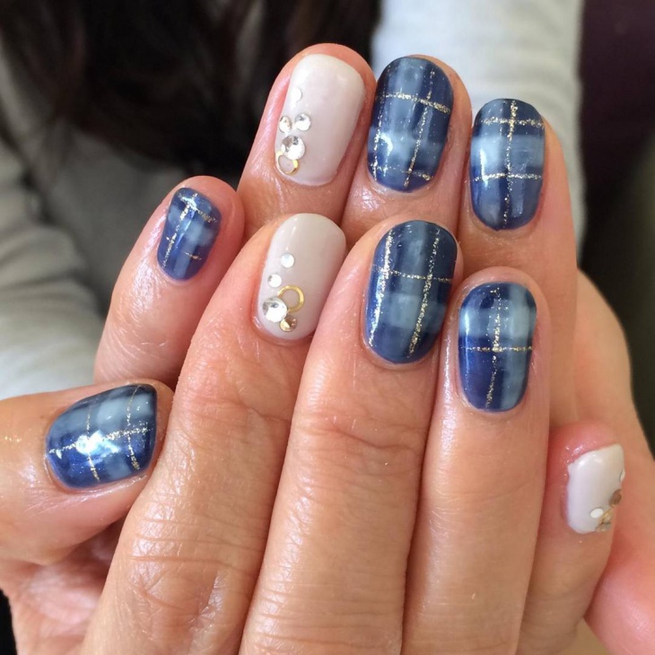 blue nail design with crystals