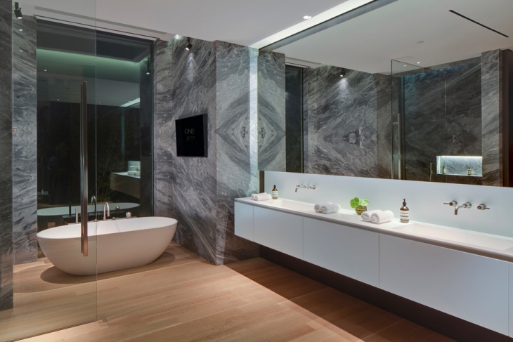 fabulous gray stone wall bathroom with mirror