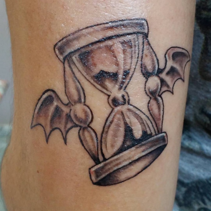 hourglass with tattoo