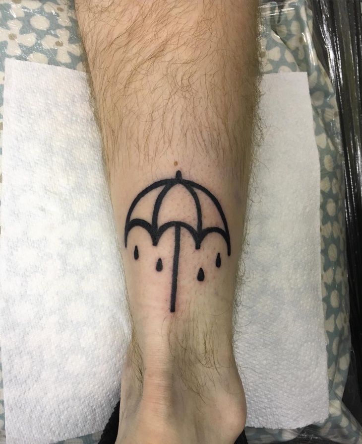 cute umbrella leg tattoo