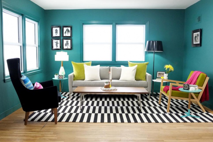 teal living room with black and white rug