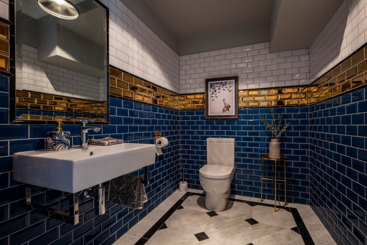 blue and gold subway tiled bathroom