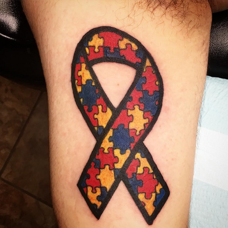 puzzle ribbon tattoo
