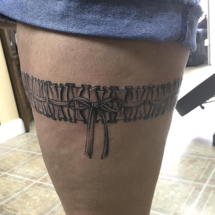 black and grey lace leg tattoo