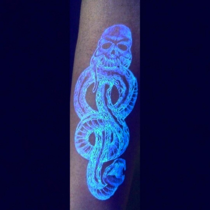 snake black light hand tattoo