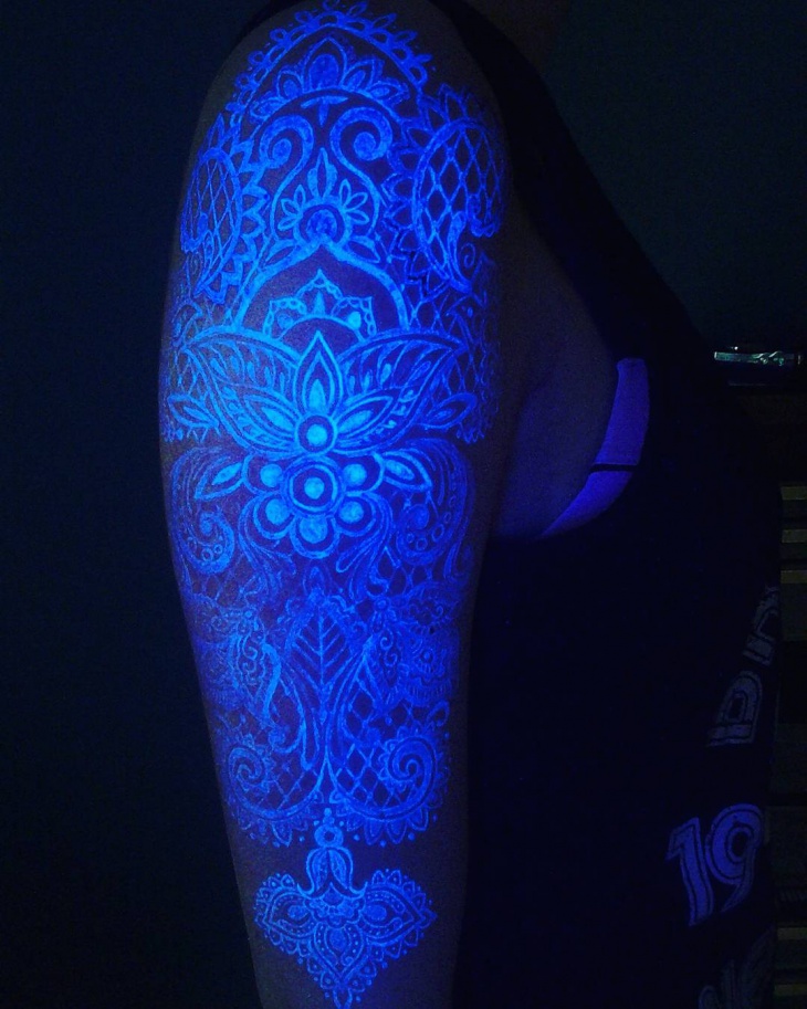 floral black light sleeve tattoo