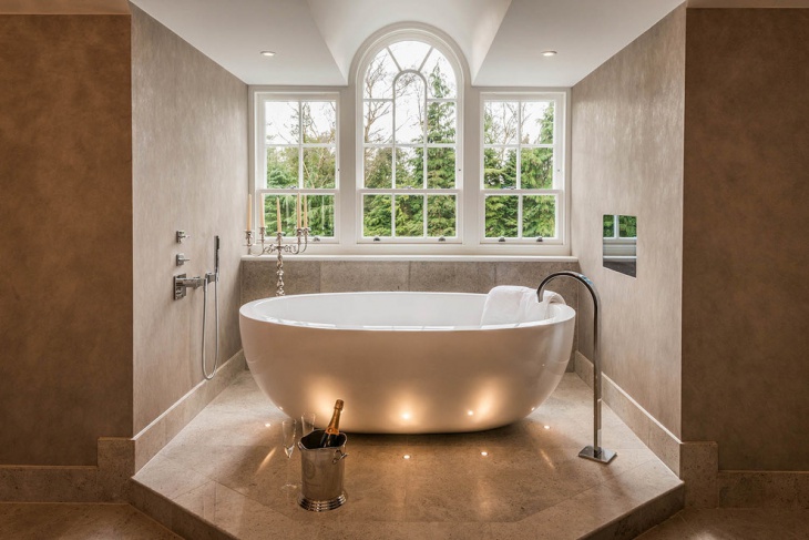 bath tub enclosed with granite walls