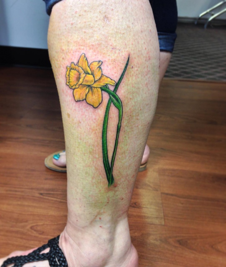 yellow daffodil flower tattoo