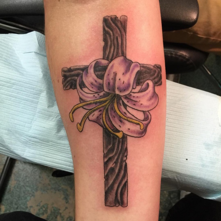 lily with cross tattoo