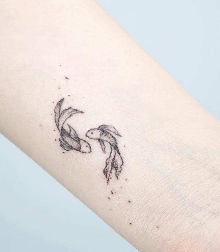 little fish hand tattoo