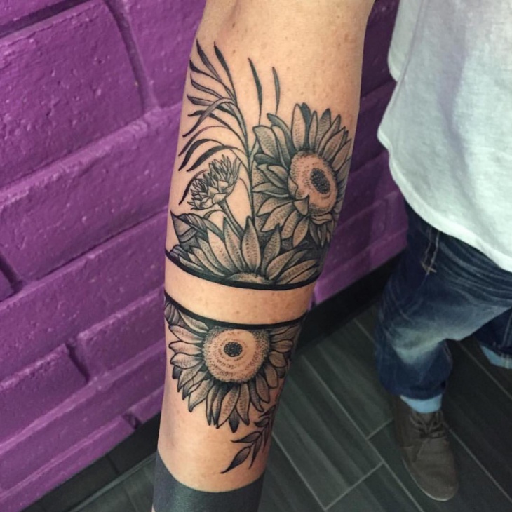 band flower arm tattoo