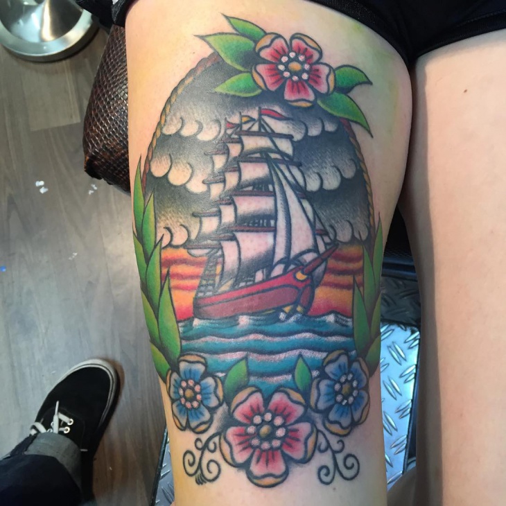 ship tattoo with floral tattoo