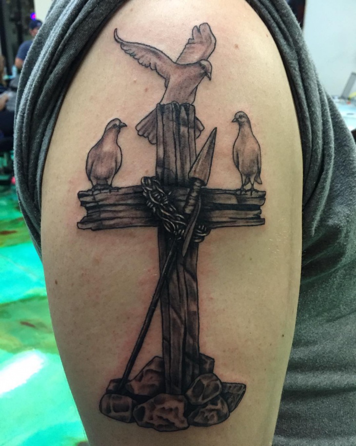 christian symbol with bird tattoo