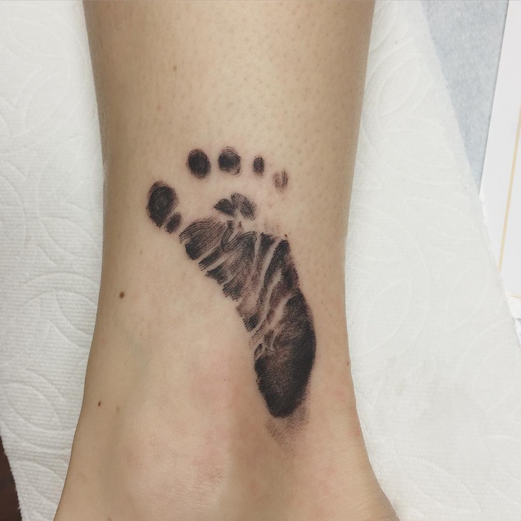 baby foot print tattoo idea