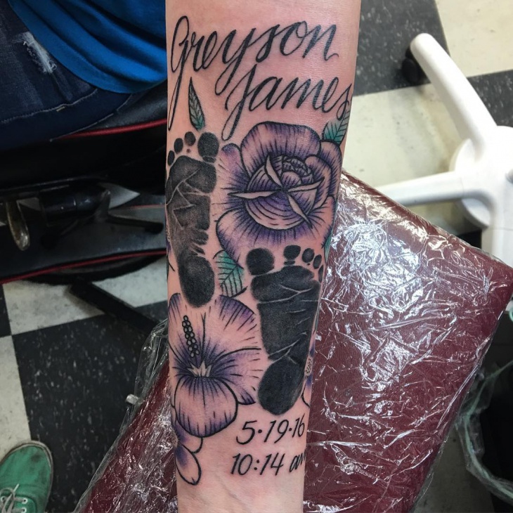 flowers with baby feet tattoo