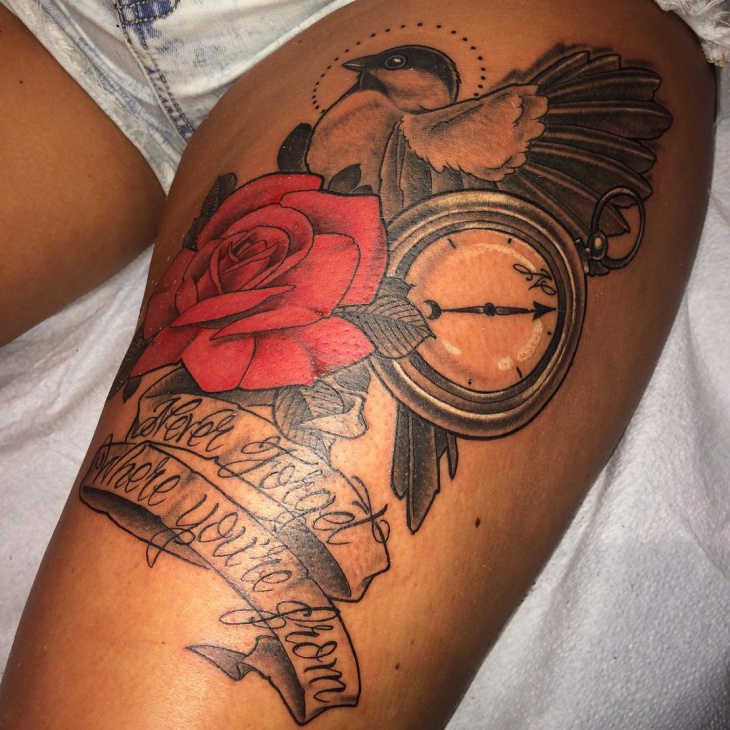 banner rose tattoo on thigh