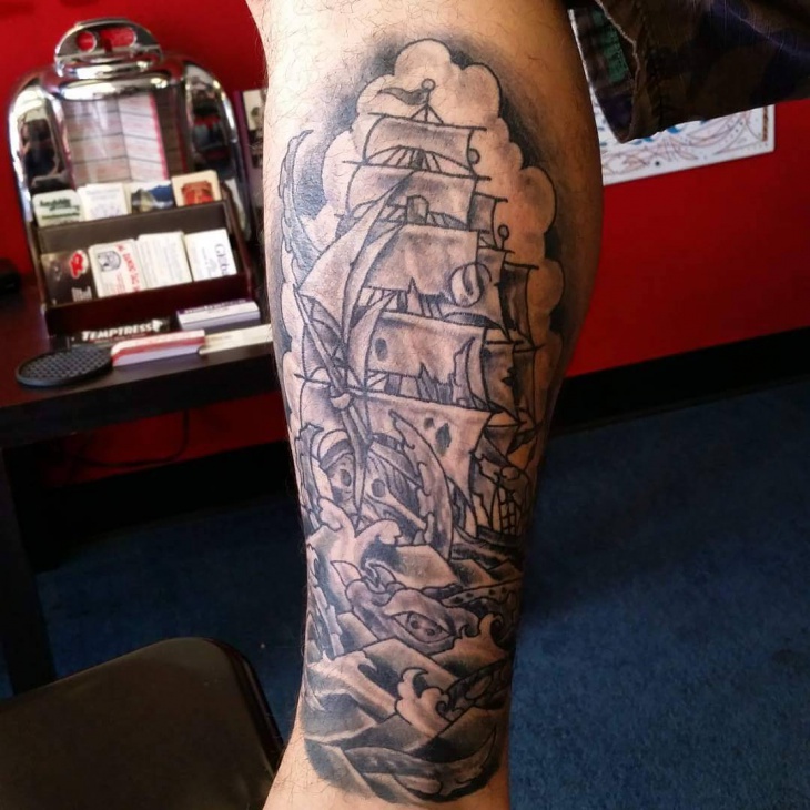 black and grey navy leg tattoo