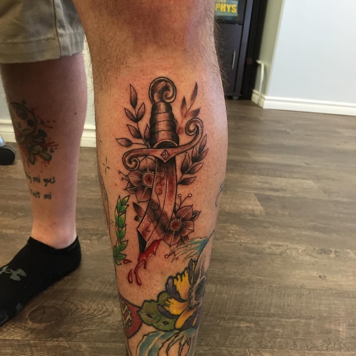 dagger leg tattoo for men
