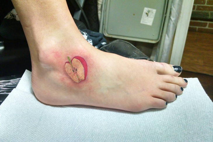 half apple ankle tattoo