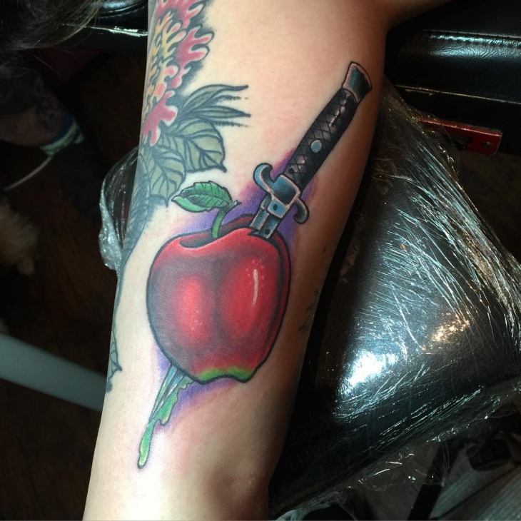 apple with knife tattoo