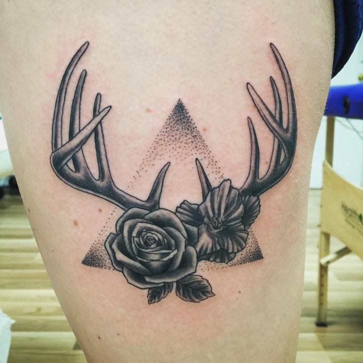 rose with deer antler tattoo