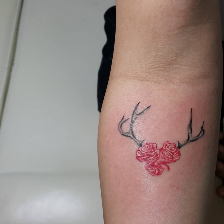 red rose with antler tattoo