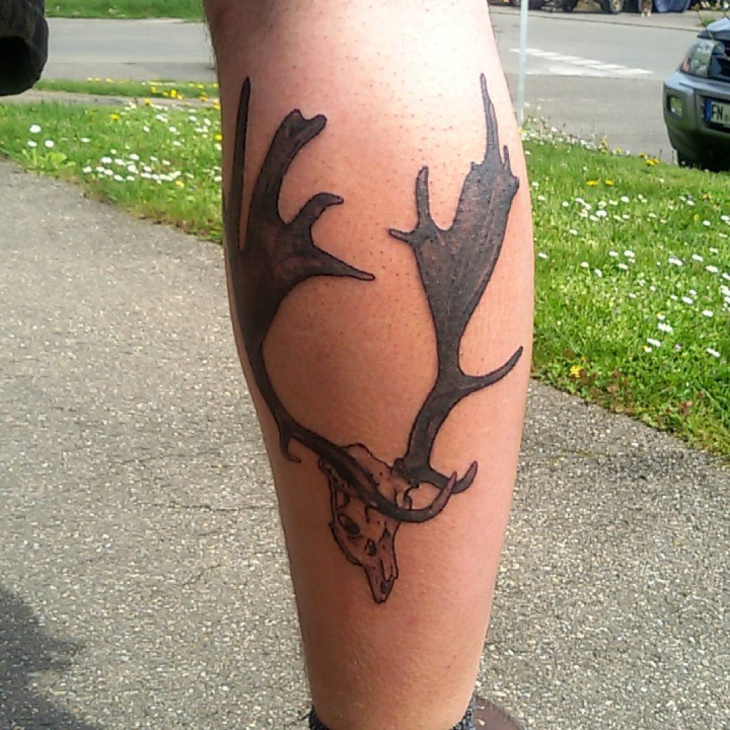 simple deer antler tattoo on leg