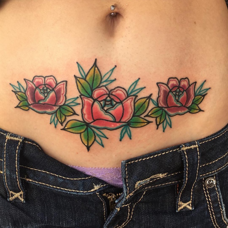 colorful roses lower stomach tattoo