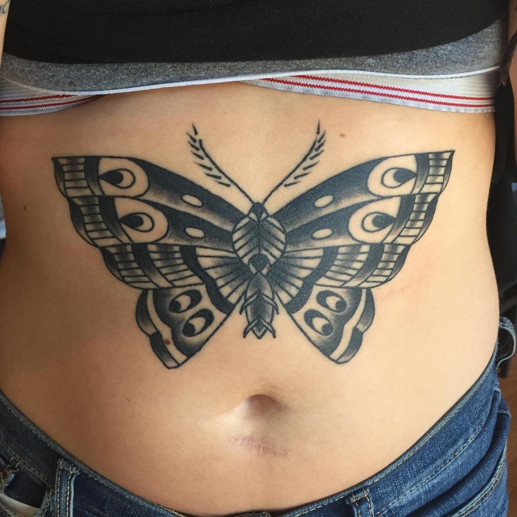 butterfly tattoo above stomach