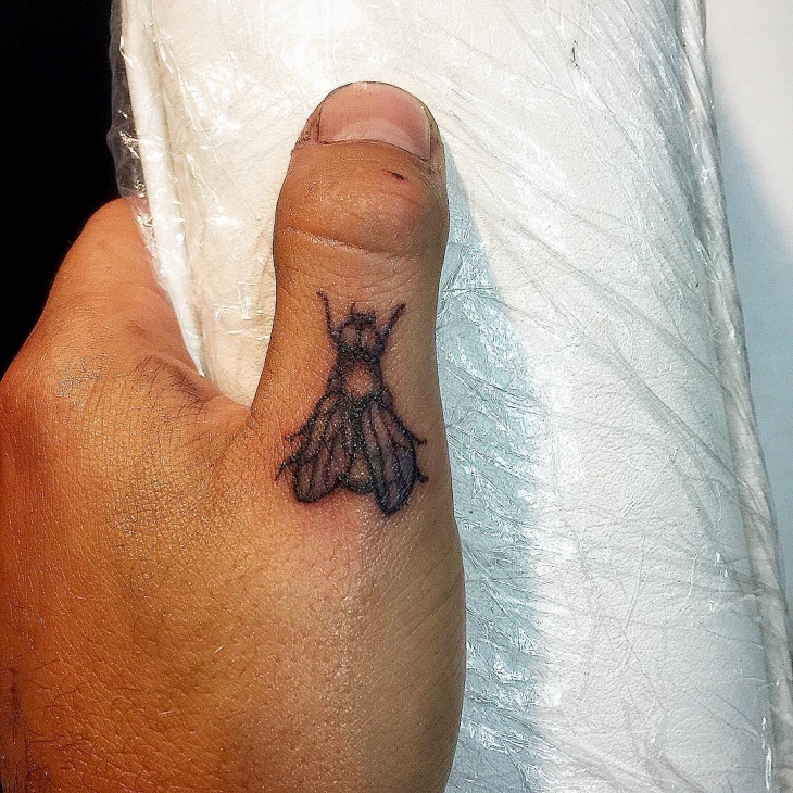 insect tattoo design on finger