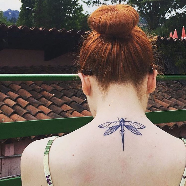 dragon fly tattoo on neck