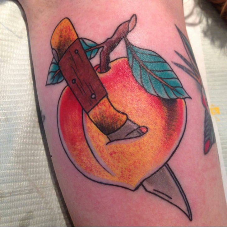 knife with friut tattoo