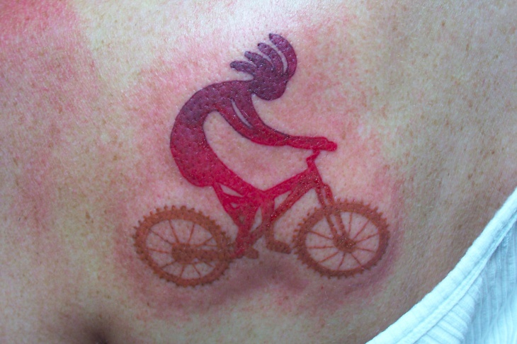 kokopelli bike tattoo