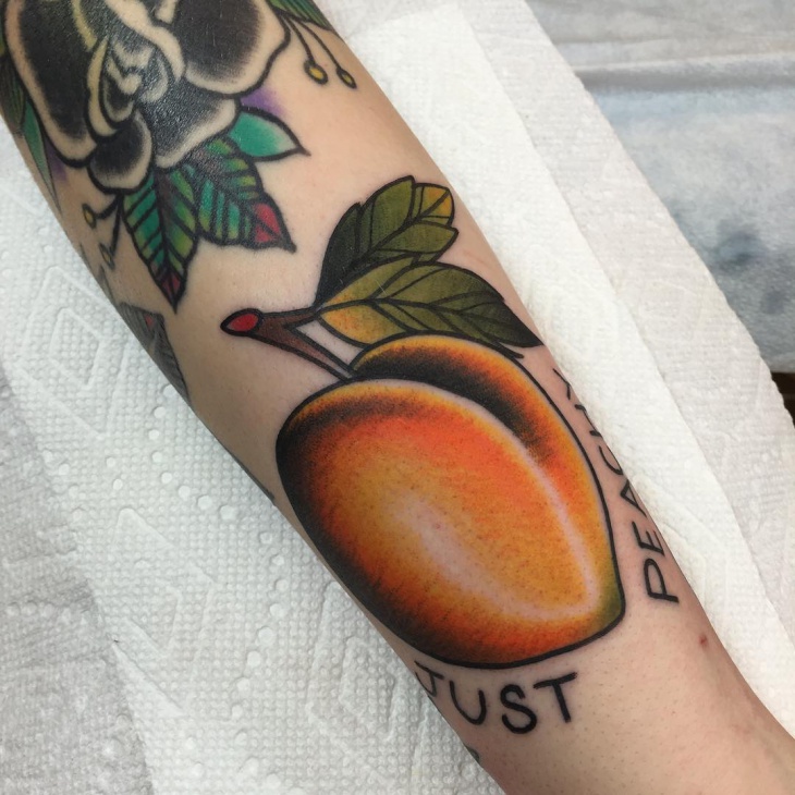 peach fruit hand tattoo design