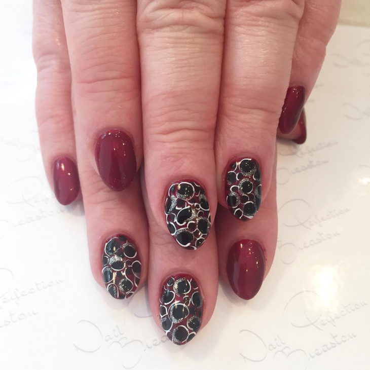 black and maroon gel nails