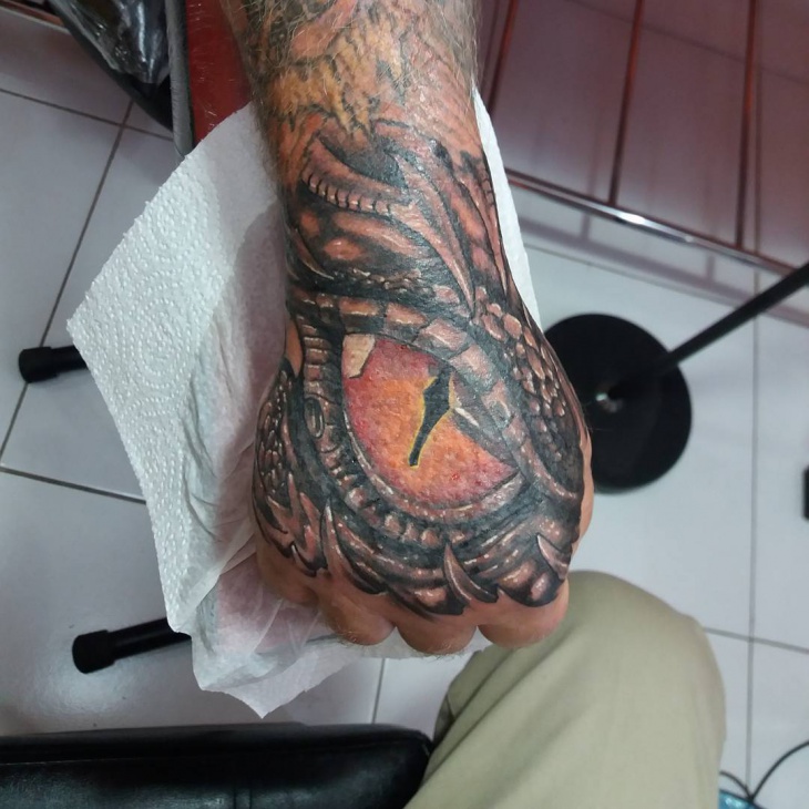 dragon eye palm tattoo design